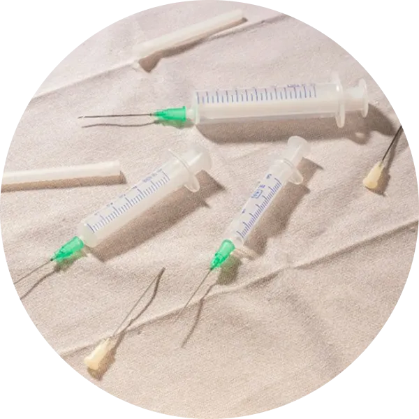 needles on top of paper